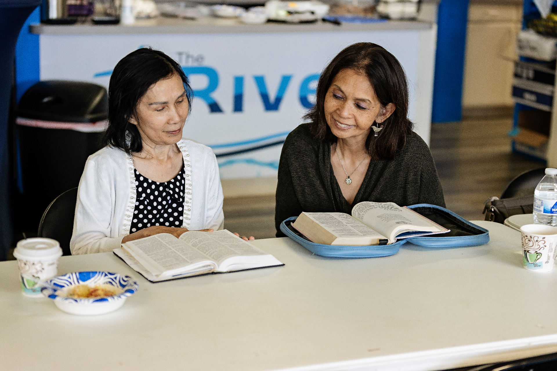 Women studying the Bible together