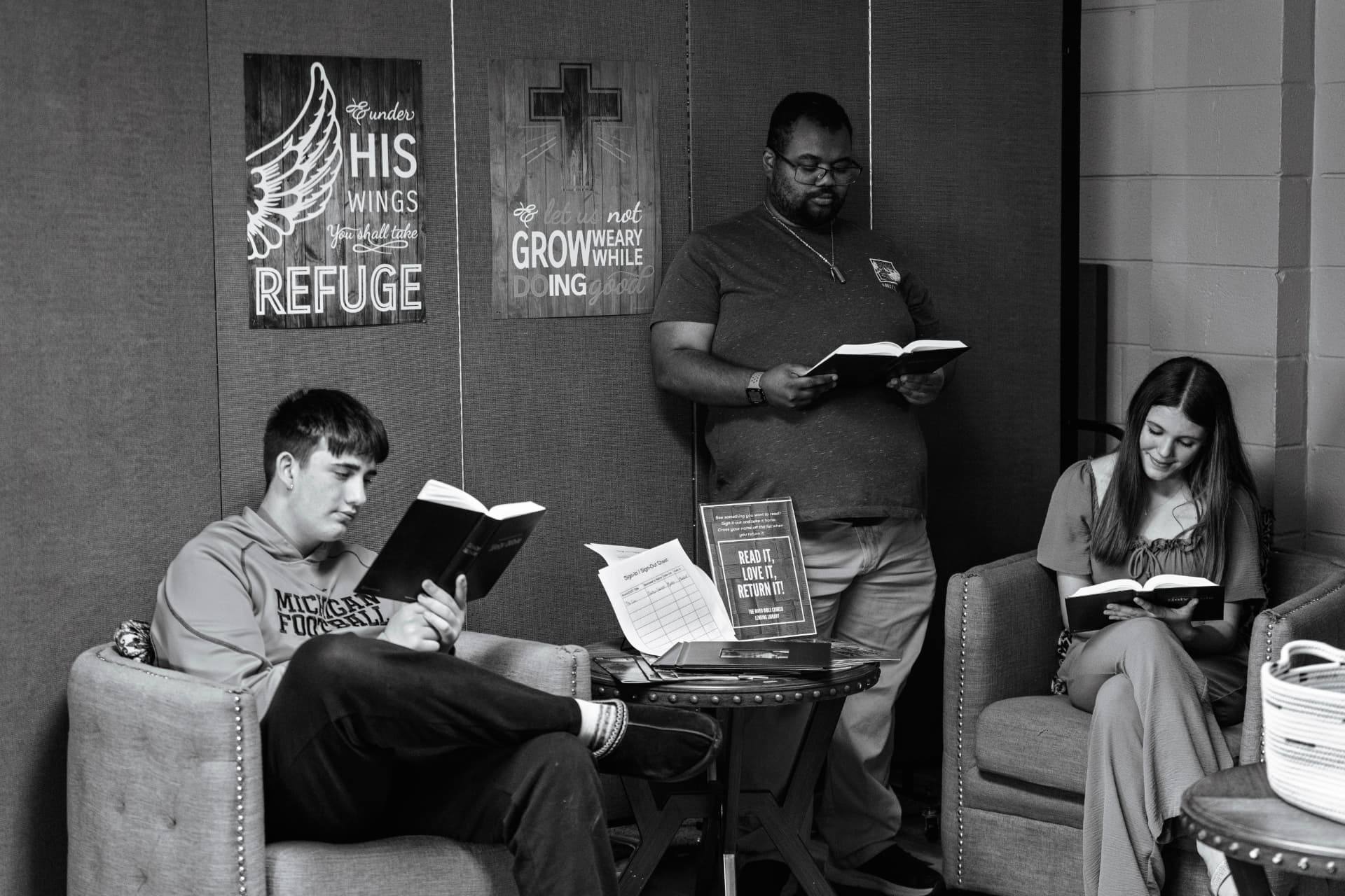 Students reading Scripture together in the church library